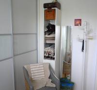 A comfortable armchair with a wooden decor floor in a 3-room apartment.