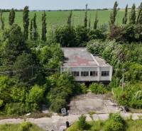 A building surrounded by vegetation, suitable for commercial land in Ivanka pri Nitre.