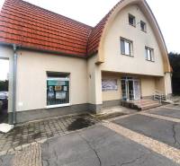 The building on Children's Square in Galanta with a red arched roof and an entrance ramp.