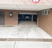Entrance to the garages on Gajova Street in Bratislava - Old Town, with parked cars.