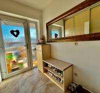 Entrance hallway with a mirror and storage space in a 4-room apartment.