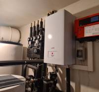 Technical equipment in a family house with a boiler and a water tank.