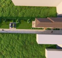 Aerial view of the access road, cars, and greenery near the 2-room apartment on Litoměřická Street in Topoľčianky.