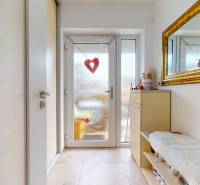 Entrance hallway of a 4-room apartment with a large mirror and heart-shaped decoration.