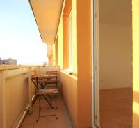 The balcony of a 2-room apartment on Soblahovská in Trenčín with outdoor seating.
