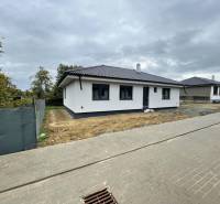 A family house in Soľ with a white facade and a dark roof.