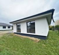 A family house in Prešov with a garden and large windows, featuring spacious and bright interiors.