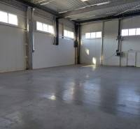 A view into an empty hall with light walls in warehouses and halls.