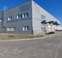 Warehouses and halls on Technická Street in Bratislava - Ružinov with parking and traffic signs.