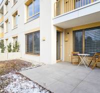 Exterior of a 2-room apartment on Cukrovarska Street in Trnava, tiles and terrace with furniture.