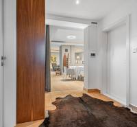Entrance hall with tiles and a fur rug in a 4-room apartment.
