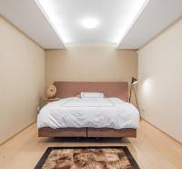 Bedroom in a 4-room apartment with hallway lighting and flooring with a wooden decor.