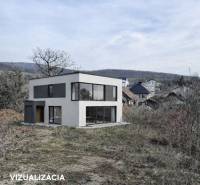 House in Residential Land - surrounded by nature in the town of Nováčany, with hills in the background.