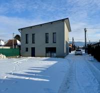A family house on the snowy Gyňovská street in Čaňa with modern architecture.