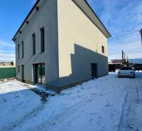 A family house on Gyňovská Street in Čaňa with a peaceful snowy yard.