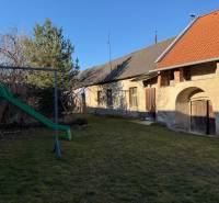 The garden of a family house on Bratislavská Street in Svätý Jur with a waterslide.