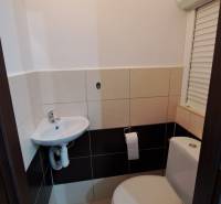 Bathroom in a 2-room apartment with a toilet and a sink.