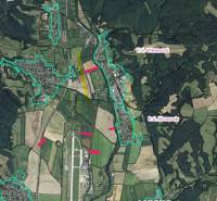 Aerial map of agricultural and forest lands around Badín.
