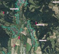 A geographical map shows agricultural and forest lands near the village of Badín and its surroundings.