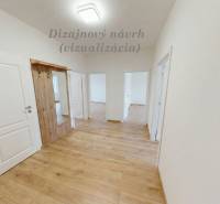 A hallway with a wooden decor floor and white doors in a 3-room apartment.