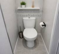 A toilet with gray tiles and a shelf in a 3-room apartment.