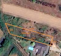 Aerial view of a residential plot in Ratnovce with a marked area of 1052 m².