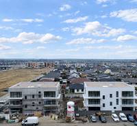 New buildings on Dúhová Street in Slovenský Grob with a view of the surrounding development.