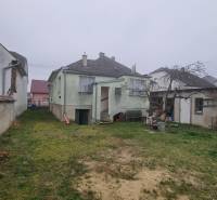A family house in Malé Leváre with a garden and a pitched roof.