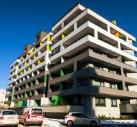 Apartment building on Strojárenská Street in Košice, Old Town area, with colorful balconies.