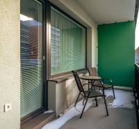 Balcony of a 2-room apartment with two chairs and a table, Strojárenská, Košice - Staré Mesto district.