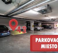 Underground parking space marked 43, surrounded by parked cars.