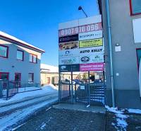 Buildings and billboards on Osloboditeľov Street, Košice - Barca district, Offices.