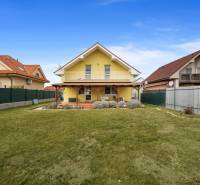 A family house on Stredná in Hviezdoslavov with a lawn and a veranda.