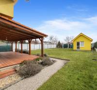 A family house in Hviezdoslavov on Stredná Street with a terrace and a garden.