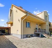 A family house on Tehelná Street in Sereď with a shelter and a garden.