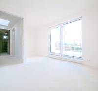 A bright interior in a family house with large sliding doors and a terrace.