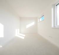 A bright interior of a room with white walls and windows, family house.