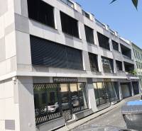 The building on Jozefská Street in Bratislava with showroom displays and offices.