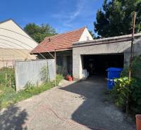 Family house in Drahovce on Drahovce street with a carport and garden.