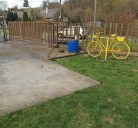 Yellow bicycle and fence on the property in Jasenovce, Jesenovce Street, Land - residential.