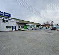 Commercial premises at Strojnická 10, Ľubotice, with an exterior warehouse for building materials.