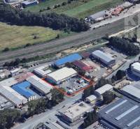 Aerial view of commercial premises in Ľubotice at Strojnická 10, surrounded by greenery.