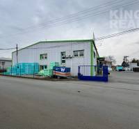 The commercial building at Strojnická 10 in Ľubotice with a large amount of storage materials.