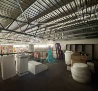 Storage spaces with cartons and materials in commercial premises.