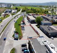 Commercial land on Petrovianska Street in Prešov surrounded by an industrial zone and a road.