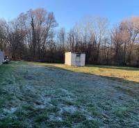 Fenced plot in Malé Leváre for living with a grassy area and a wooden shelter.