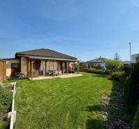 Garden at a family house on Pod privádzačom Street in Trenčín with a lawn and a gazebo.