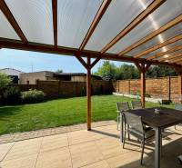 The terrace of a family house on Pod privádzačom Street in Trenčín with a lawn and seating.