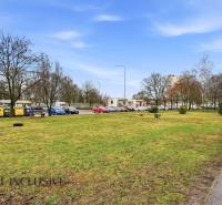 A view of the parking lot and surrounding trees in the town of Veľký Meder.