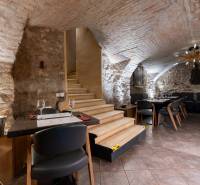 Vaulted ceiling with rustic walls in gastronomy.
